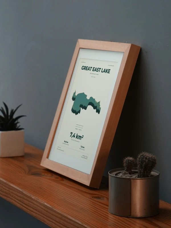 The Great East Lake artwork digitally placed in a frame on a shelf beside plants. Framing and proportions are illustrative.
